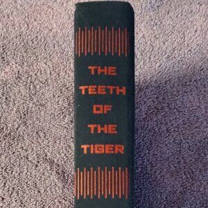 New Book wit out the cover sleeve The Teeth of the Tiger Tom Clancy